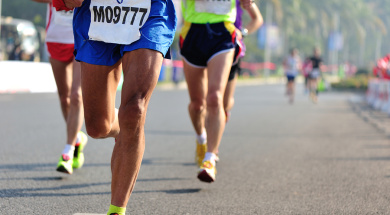 Marathon running race, people feet on city road