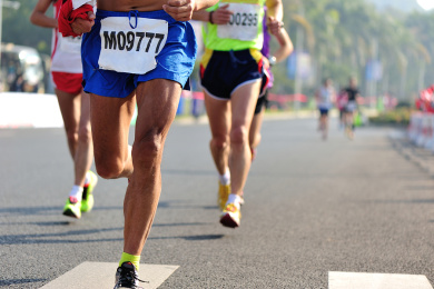 Marathon running race, people feet on city road