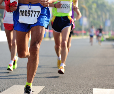 Marathon running race, people feet on city road