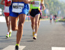 Marathon running race, people feet on city road