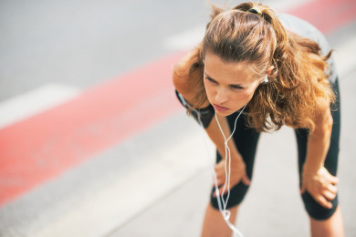 Portrait Of Tired Fitness Young Woman Outdoors In The City Catch