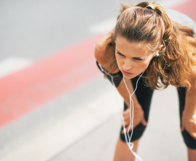 Portrait Of Tired Fitness Young Woman Outdoors In The City Catch