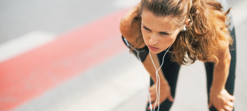 Portrait Of Tired Fitness Young Woman Outdoors In The City Catch