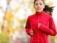 Woman runner running in autumn