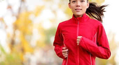 Woman runner running in autumn