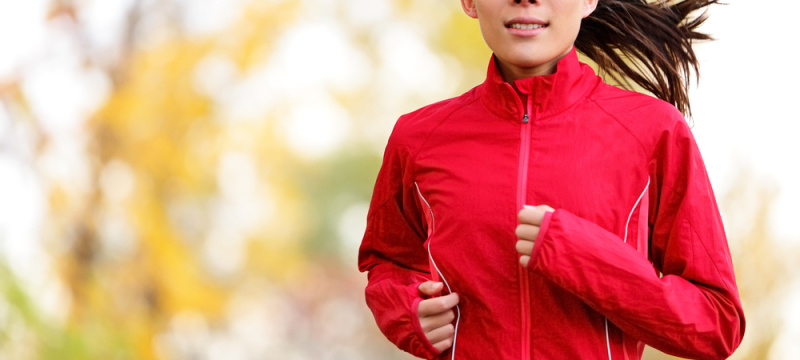 Woman runner running in autumn